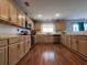 Well-lit kitchen featuring stainless steel appliances and wood flooring at 7277 Sweetgrass Blvd, Hanahan, SC 29410