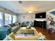 Bright and airy living room with comfortable seating, hardwood floors, and a fireplace at 7277 Sweetgrass Blvd, Hanahan, SC 29410