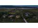 Breathtaking aerial view of 79 Trailing Vine property nestled among lush trees and waterways at dusk at 79 Trailing Vine Way, Kiawah Island, SC 29455