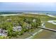 Breathtaking aerial view of the home, nestled amongst lush greenery and scenic waterfront views at 79 Trailing Vine Way, Kiawah Island, SC 29455