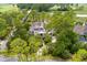 Beautiful home with circular drive surrounded by lush greenery and trees at 79 Trailing Vine Way, Kiawah Island, SC 29455