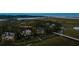 Aerial view of a beautiful home situated among lush greenery and waterways at 79 Trailing Vine Way, Kiawah Island, SC 29455