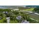 Beautiful aerial view of the property and waterfront, nestled amidst lush greenery and winding waterways at 79 Trailing Vine Way, Kiawah Island, SC 29455