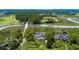 Stunning aerial view of the property with lush greenery, waterways, and a golf course nearby at 79 Trailing Vine Way, Kiawah Island, SC 29455
