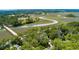 Aerial view of a property with lush greenery, a winding river, and a nearby golf course at 79 Trailing Vine Way, Kiawah Island, SC 29455