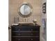 An earthy powder room features a stone sink and textured wall at 79 Trailing Vine Way, Kiawah Island, SC 29455