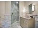 Bathroom with walk-in glass shower with marble surround and granite vanity with updated sink fixtures at 79 Trailing Vine Way, Kiawah Island, SC 29455