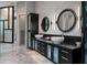 Modern bathroom featuring a double sink vanity, stone accent wall, and sleek black cabinetry at 79 Trailing Vine Way, Kiawah Island, SC 29455