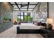 Luxurious bedroom with a statement art piece and a linear electric fireplace at 79 Trailing Vine Way, Kiawah Island, SC 29455