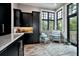 Butler's pantry with custom cabinets, granite countertops, and bright natural light at 79 Trailing Vine Way, Kiawah Island, SC 29455