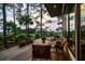 Relax on the outdoor deck, with seating overlooking stunning lush green backyard and nature at 79 Trailing Vine Way, Kiawah Island, SC 29455