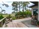 Spacious wooden deck with views of natural surroundings and cable railing at 79 Trailing Vine Way, Kiawah Island, SC 29455