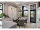 Cozy dining area with table, chairs, elegant lighting, and a view of the surrounding greenery at 79 Trailing Vine Way, Kiawah Island, SC 29455
