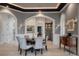 Formal dining room with wood table and velvet chairs, connected to bar area at 79 Trailing Vine Way, Kiawah Island, SC 29455