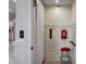 An elevator with red stool and a fire alarm is seen in the home at 79 Trailing Vine Way, Kiawah Island, SC 29455