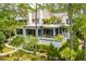 Beautiful home exterior with a private deck surrounded by mature trees and lush landscaping at 79 Trailing Vine Way, Kiawah Island, SC 29455
