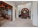 Welcoming foyer with a striking dark wood front door and ample natural light at 79 Trailing Vine Way, Kiawah Island, SC 29455