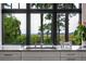 Kitchen sink under a large window with a stunning view of the outside landscape and lush trees at 79 Trailing Vine Way, Kiawah Island, SC 29455
