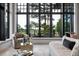 Relaxing living room featuring large windows with beautiful views of the outdoor scenery at 79 Trailing Vine Way, Kiawah Island, SC 29455