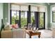 Cozy living room with comfortable seating, natural light, and a view of the backyard at 79 Trailing Vine Way, Kiawah Island, SC 29455