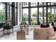 Relaxing living room featuring large windows with beautiful views of the outdoor scenery at 79 Trailing Vine Way, Kiawah Island, SC 29455