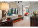 Bright main bedroom boasting high ceilings, a canopy bed, and views of the outdoor scenery at 79 Trailing Vine Way, Kiawah Island, SC 29455