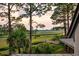 Scenic view of a marsh landscape, showcasing a wooden bridge and distant waterways at 79 Trailing Vine Way, Kiawah Island, SC 29455