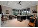 Home office with coffered ceilings, recessed lighting, large windows, and custom built-in desk and shelving at 79 Trailing Vine Way, Kiawah Island, SC 29455
