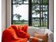 A cozy sitting area offers scenic views through large windows at 79 Trailing Vine Way, Kiawah Island, SC 29455