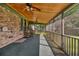 Spacious screened-in porch with ceiling fans and wood ceiling, perfect for relaxing and enjoying the outdoors at 8204 Pleasant Ridge Dr, Charleston, SC 29420