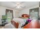 Cozy bedroom features carpet, a queen bed, with a TV in the corner of the room at 8204 Pleasant Ridge Dr, Charleston, SC 29420
