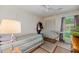Simple bedroom with twin bed, closet, and a window providing natural light at 8204 Pleasant Ridge Dr, Charleston, SC 29420