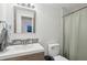 Well-lit bathroom featuring a modern vanity, clean fixtures, and neutral decor at 9 F St, Charleston, SC 29403