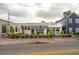 Exterior of a restaurant with curb appeal, vintage vibes and a clean, inviting storefront surrounded by greenery at 9 F St, Charleston, SC 29403