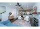 Inviting living area featuring a cozy fireplace, plush seating, and an open layout perfect for entertaining and relaxation at 977 Warrick Oaks Ln, Mount Pleasant, SC 29464