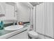 Bathroom with white fixtures, subway tile surround, and green countertops at 10 Trapman St, Charleston, SC 29401