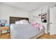 Comfortable bedroom with a gray bedspread, white pillows, and built in white shelving at 10 Trapman St, Charleston, SC 29401