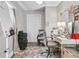 Bright room featuring a flamingo rug, stylish desk and chair, and closet for storage at 10 Trapman St, Charleston, SC 29401
