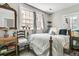 Bedroom with a large window, wood floors, and comfy bedding at 10 Trapman St, Charleston, SC 29401