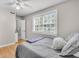 Bright bedroom with a large window and hardwood floors with an attached bathroom at 10 Trapman St, Charleston, SC 29401
