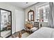 Bedroom with a large window, wood floors, and closet at 10 Trapman St, Charleston, SC 29401