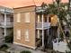 Attractive two-story house with a cozy balcony and an inviting staircase, located in the city at 10 Trapman St, Charleston, SC 29401