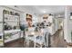 Eat-in kitchen featuring white cabinets and modern appliances with adjacent dining space at 10 Trapman St, Charleston, SC 29401