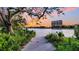 Scenic lakeside view with lush greenery and a building at sunset at 10 Trapman St, Charleston, SC 29401