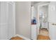 Laundry area with a stacked washer and dryer next to a full bathroom at 10 Trapman St, Charleston, SC 29401