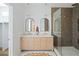 Modern main bathroom featuring a double vanity, stand alone shower with glass door, and neutral decor at 1014 E Erie Ave, Folly Beach, SC 29439