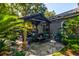 Relaxing backyard with covered patio, seating area, and mature landscaping for outdoor enjoyment at 102 Cottonwood Dr, Summerville, SC 29483