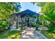 Backyard patio with shaded pergola with outdoor seating and lush landscaping at 102 Cottonwood Dr, Summerville, SC 29483