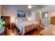 Cozy bedroom showcasing a queen-size bed, with wooden flooring and light-colored walls at 102 Cottonwood Dr, Summerville, SC 29483