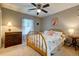Calm bedroom with neutral tones, showcasing a dresser, a bed, and a lamp at 102 Cottonwood Dr, Summerville, SC 29483